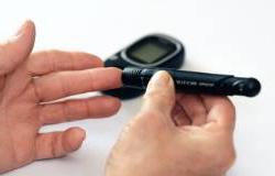 A person checks their blood sugar levels. 